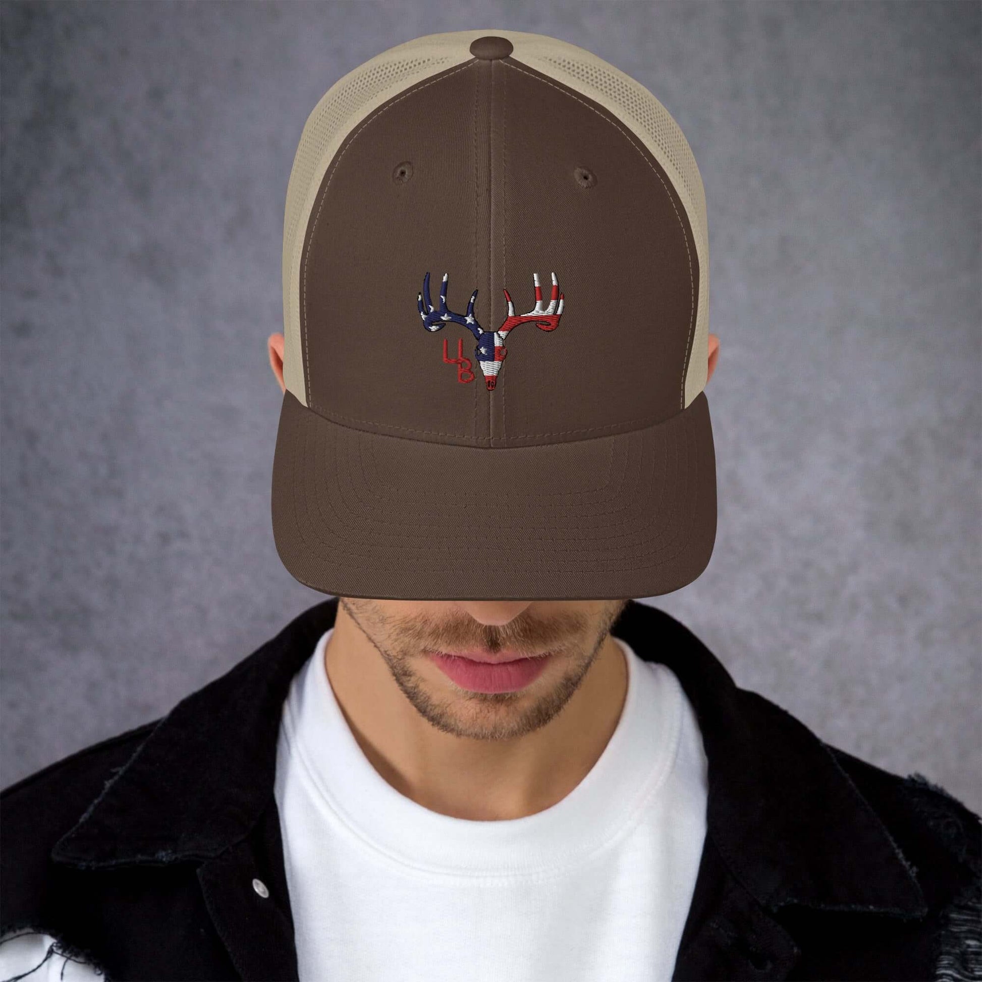 4B Americana Deer Trucker Hat This six-panel trucker cap with a mesh back will be a comfy and classic choice for a perfect day in the sun. • 60% cotton, 40% polyester • Mid-profile cap with a low-profile embroidery area • Structured, six-panel cap • 3.5″