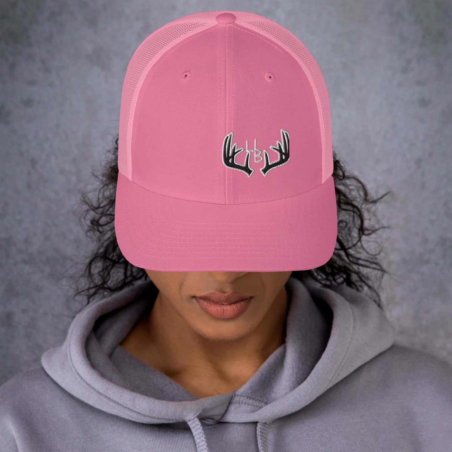 4B Antlers 2 Trucker Hat This six-panel trucker cap with a mesh back will be a comfy and classic choice for a perfect day in the sun. • 60% cotton, 40% polyester • Mid-profile cap with a low-profile embroidery area • Structured, six-panel cap • 3.5″ crown