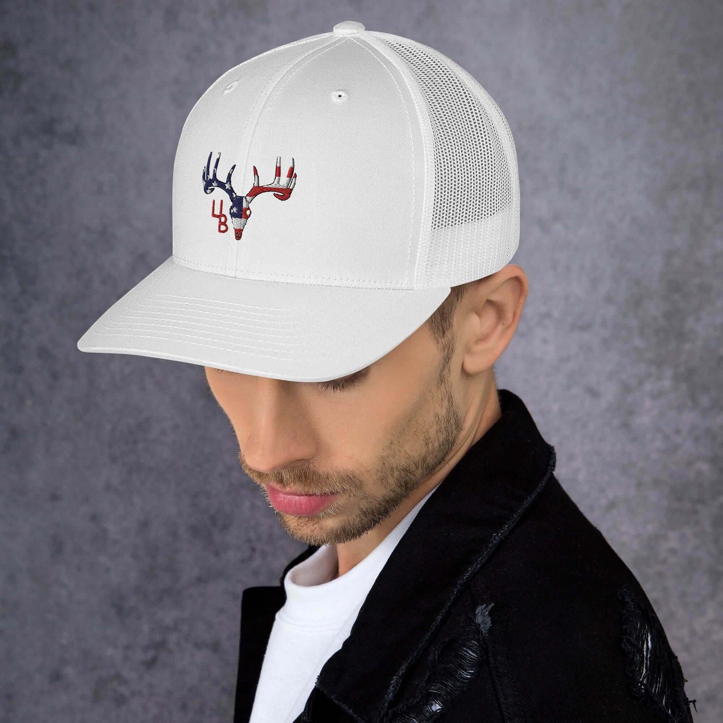 4B Americana Deer Trucker Hat This six-panel trucker cap with a mesh back will be a comfy and classic choice for a perfect day in the sun. • 60% cotton, 40% polyester • Mid-profile cap with a low-profile embroidery area • Structured, six-panel cap • 3.5″